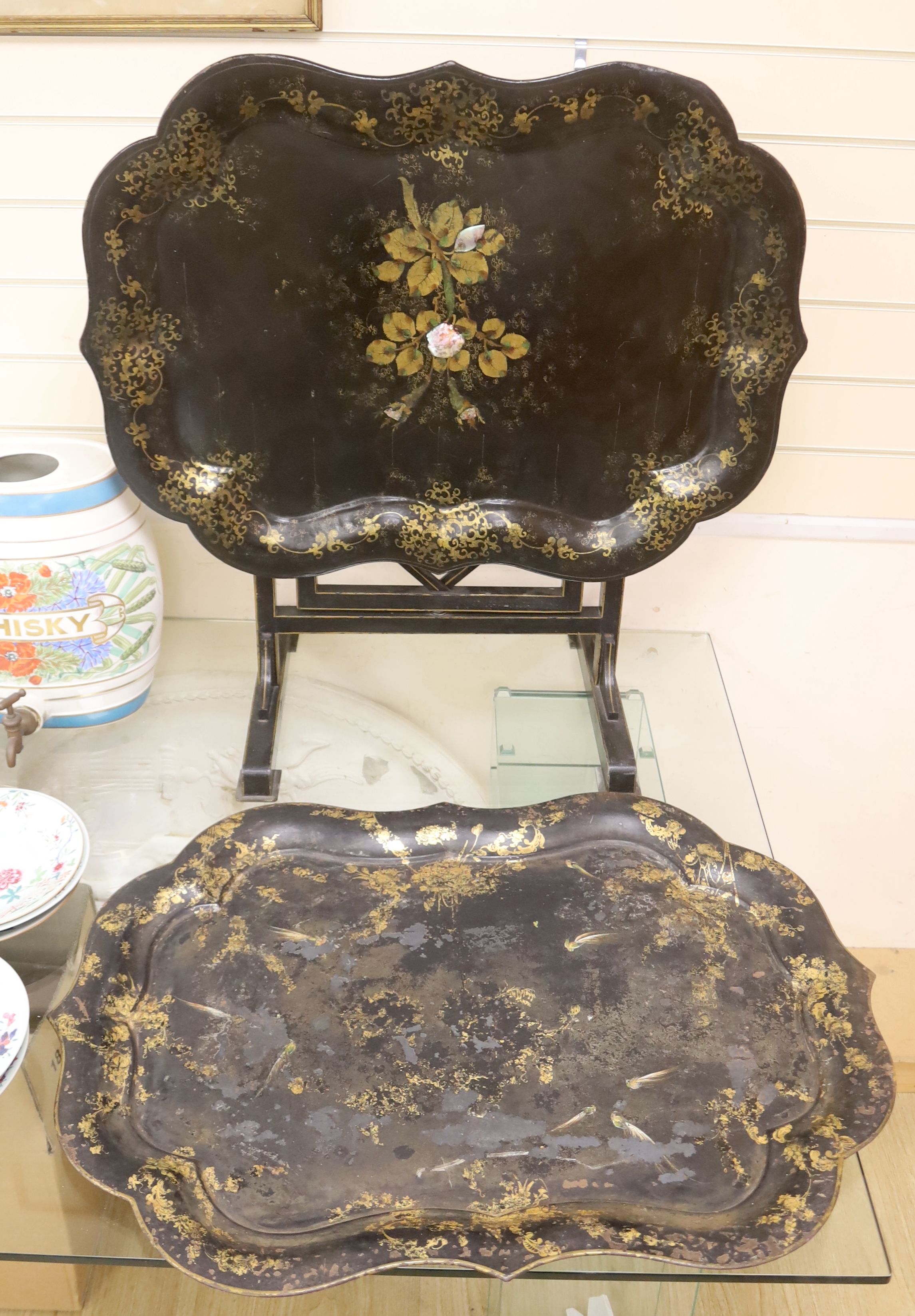 A large early Victorian papier mache tray on folding stand, 79 x 48cm, and a toleware tray